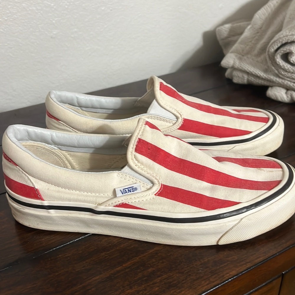 Used slip on vans red and cream striped.